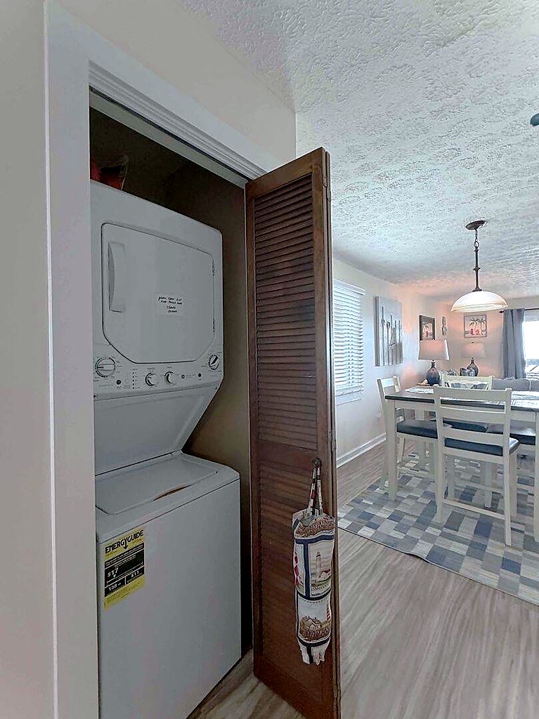 Stacked washer and dryer inside the condo